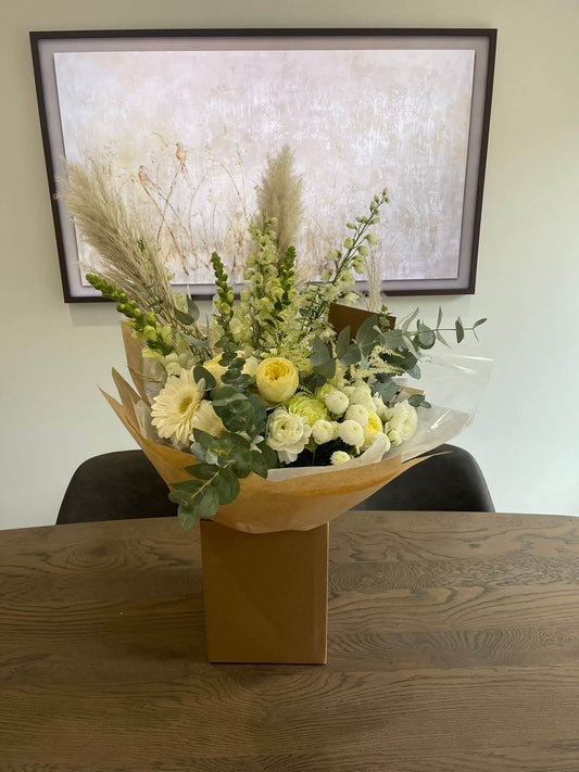 Embrace the understated beauty of nature with our neutral hand-tied flower bouquet